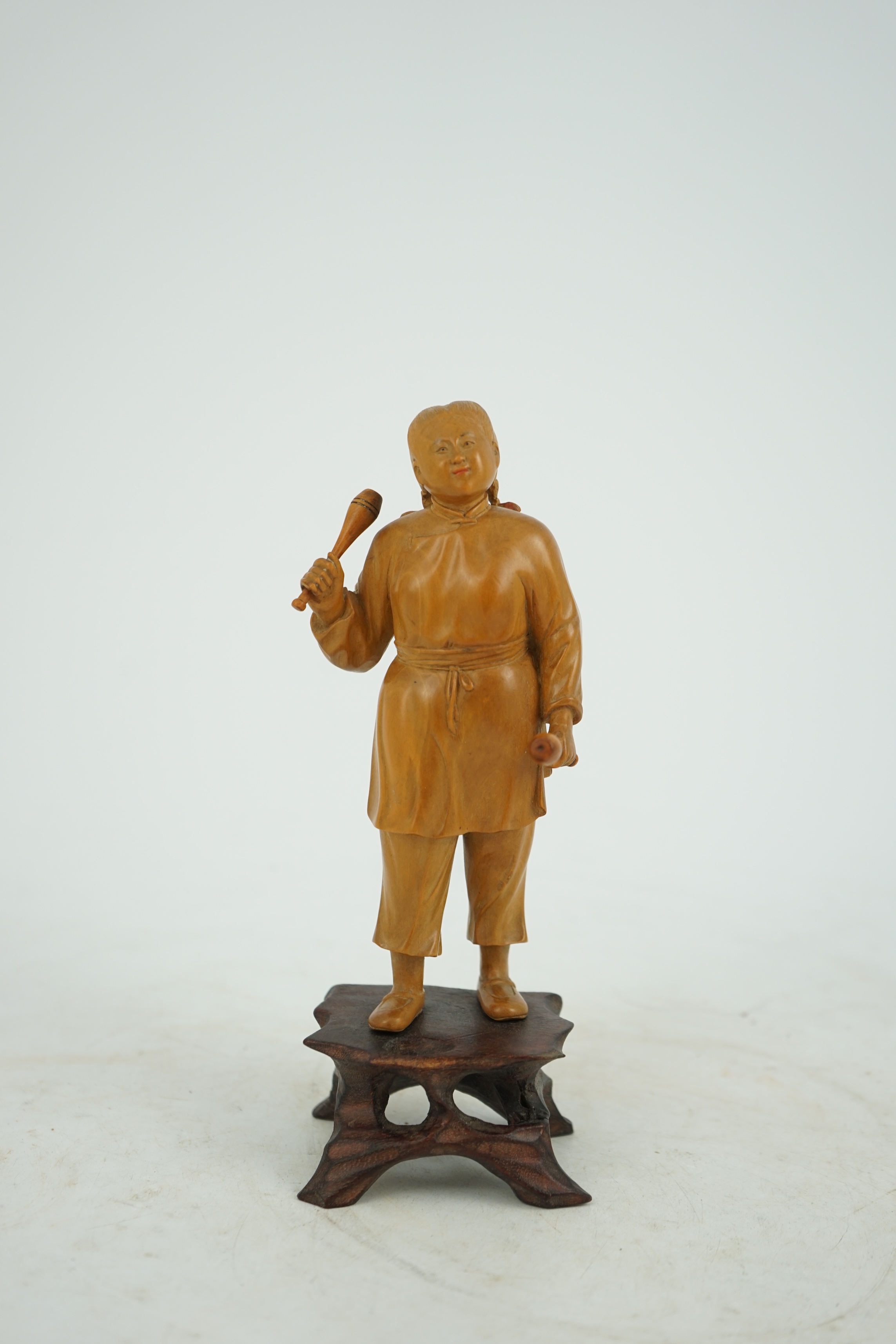 A Chinese boxwood figure of a female juggler, attributed to Zhu Zichang (1876-1934), Republic period